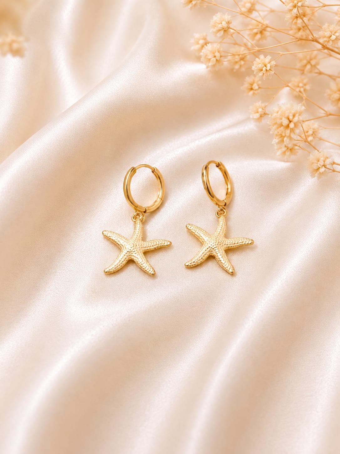 Boucles Creoles Etoile de Mer Doree — bijou en acier inoxydable, Aurelia Jewelry House