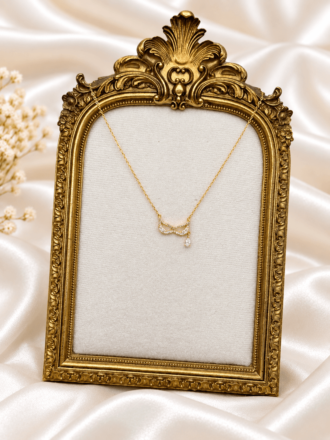 Collier Noeud Infini Goutte Cristal Dore — bijou en acier inoxydable, Aurelia Jewelry House